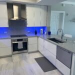 A kitchen with blue lights