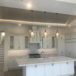 A kitchen with hanging lights
