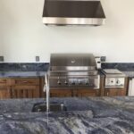 A kitchen with blue marble countertops